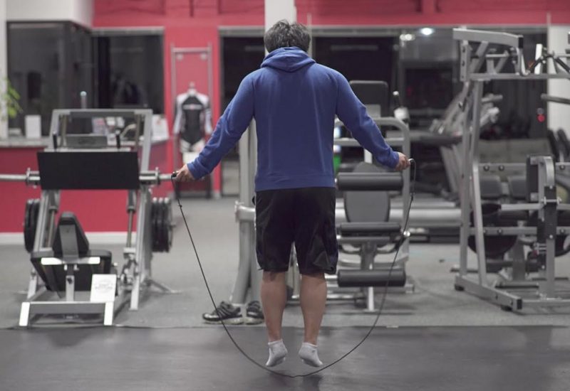 Man jumping rope inside a gym